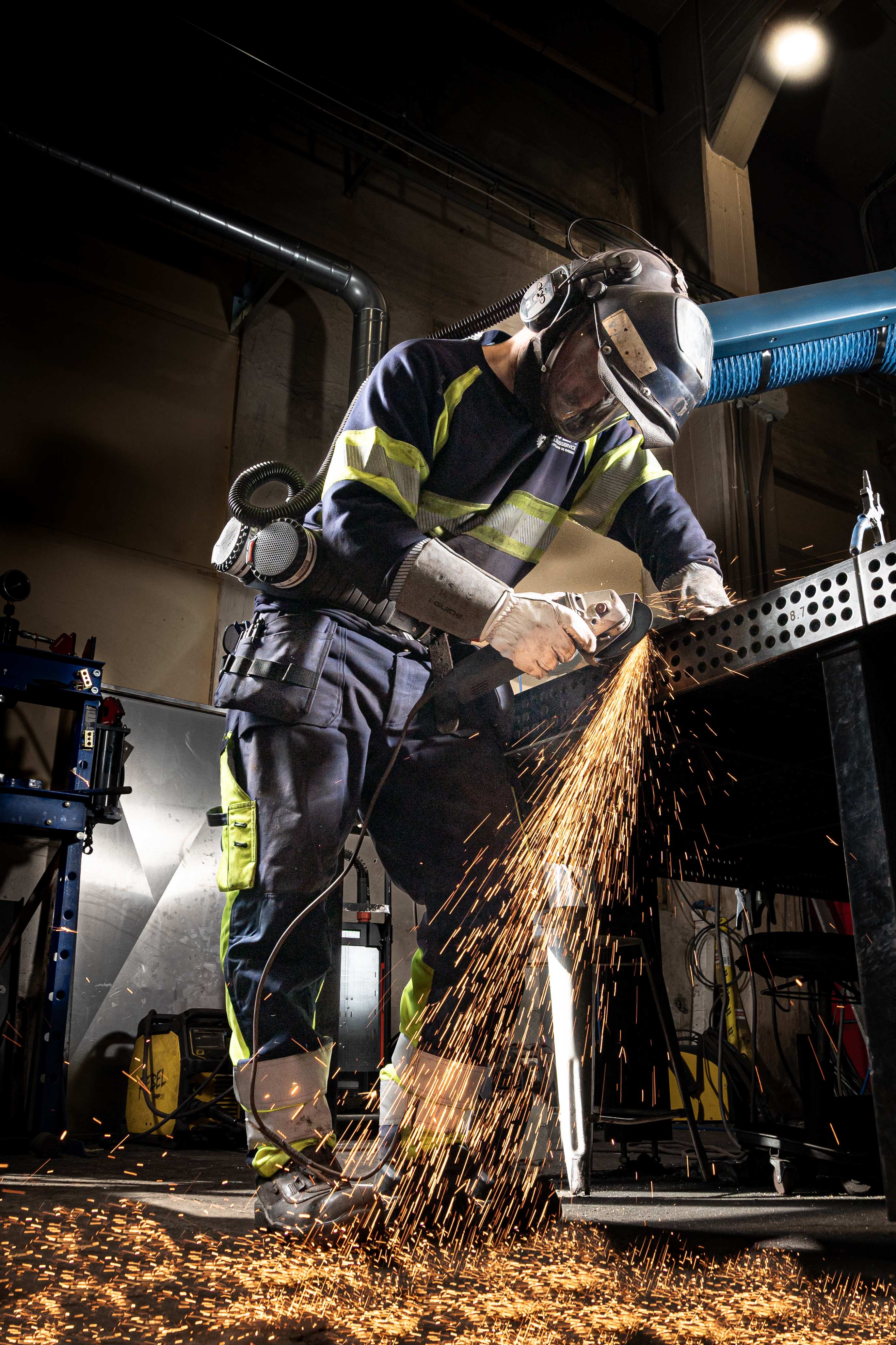 MOLA welder performing precision welding work with sparks